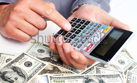 stock-photo-hand-with-a-calculator-money-saving-concept-150558464