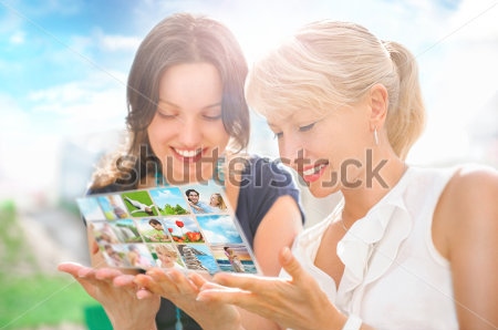 stock-photo-portrait-of-two-happy-women-mother-and-daughter-looking-their-photo-and-video-files-in-social-media-109405937