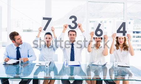 stock-photo-portrait-of-a-group-of-panel-judges-holding-score-signs-in-a-bright-office-168173945