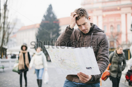 stock-photo-lost-tourist-looking-at-city-map-on-a-trip-looking-for-directions-173292284