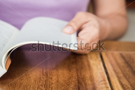 stock-photo-closeup-hand-open-book-for-reading-concept-background-130330691